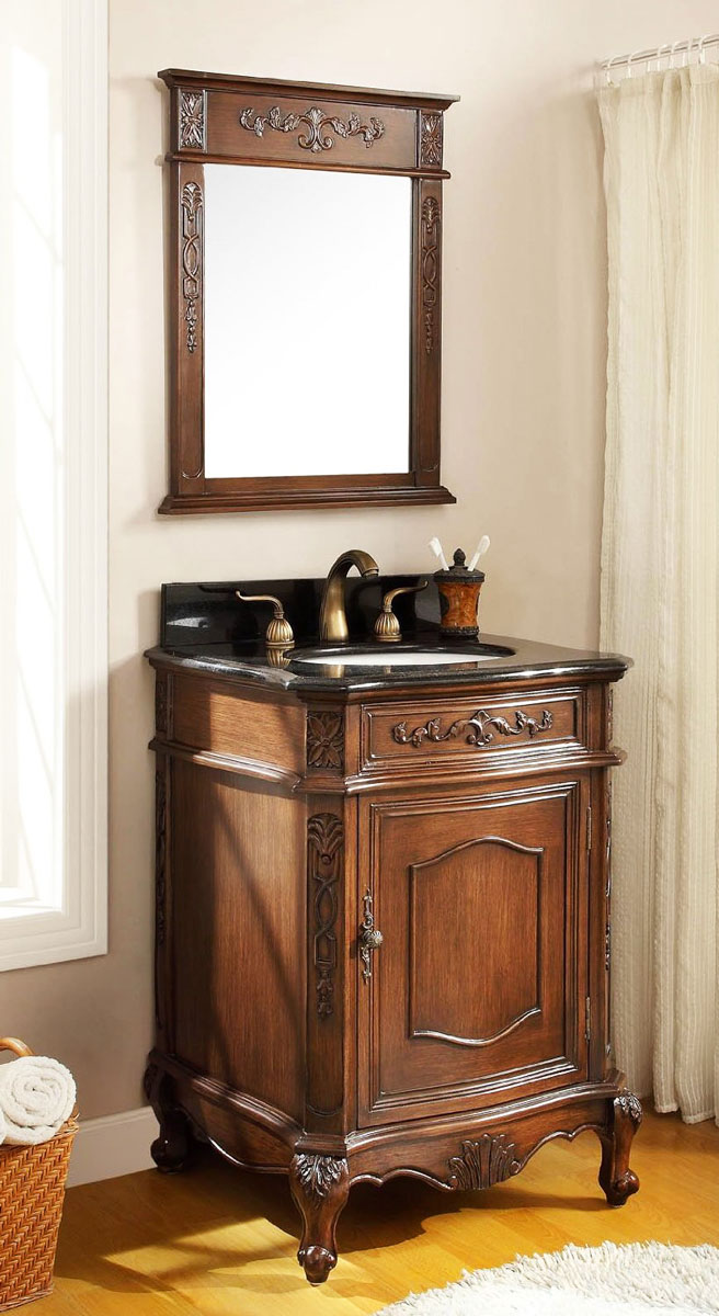 Stojąca, wykonana z dębowego drewna retro szafka łazienkowa pod umywalkę z szufladą, drzwiczkami, blatem z czarnego granitu oraz lustrem